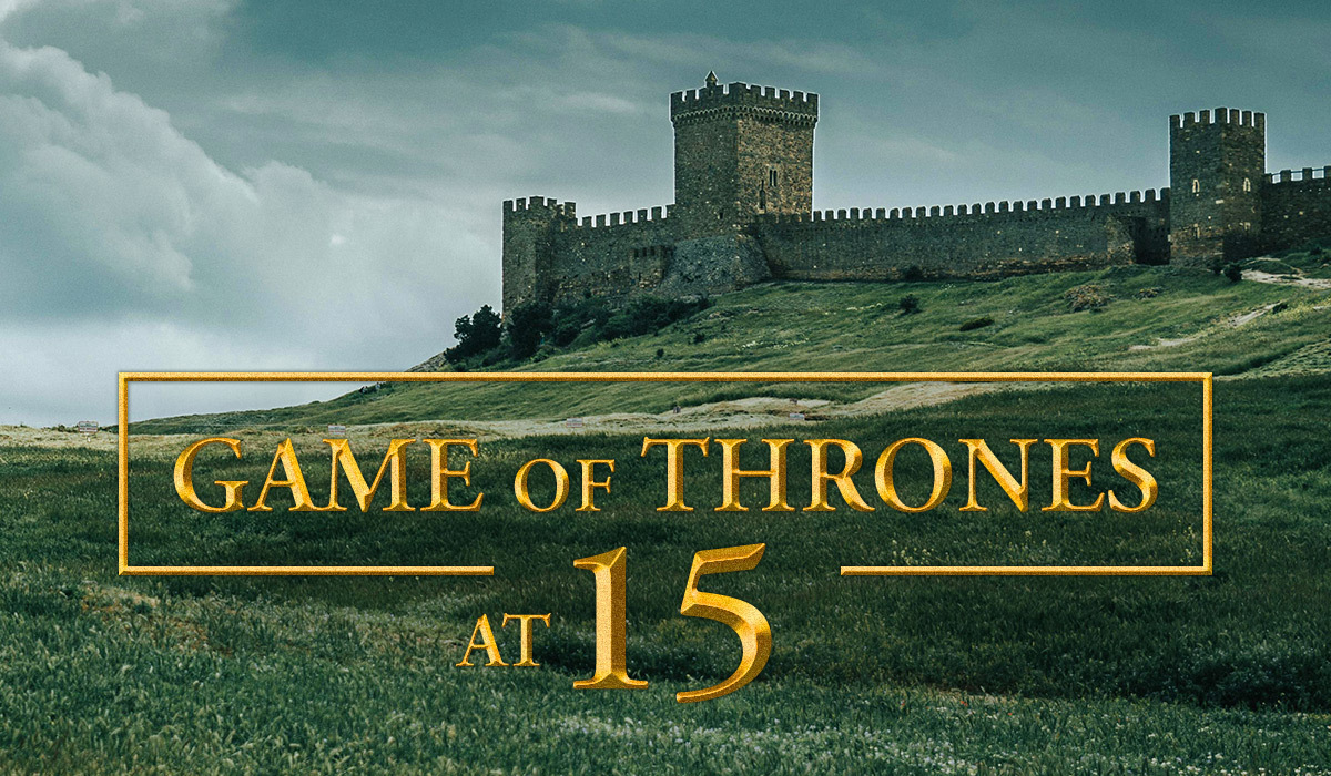 Castle on a hill in a green landscape with gold text “Game of Thrones at 15”.