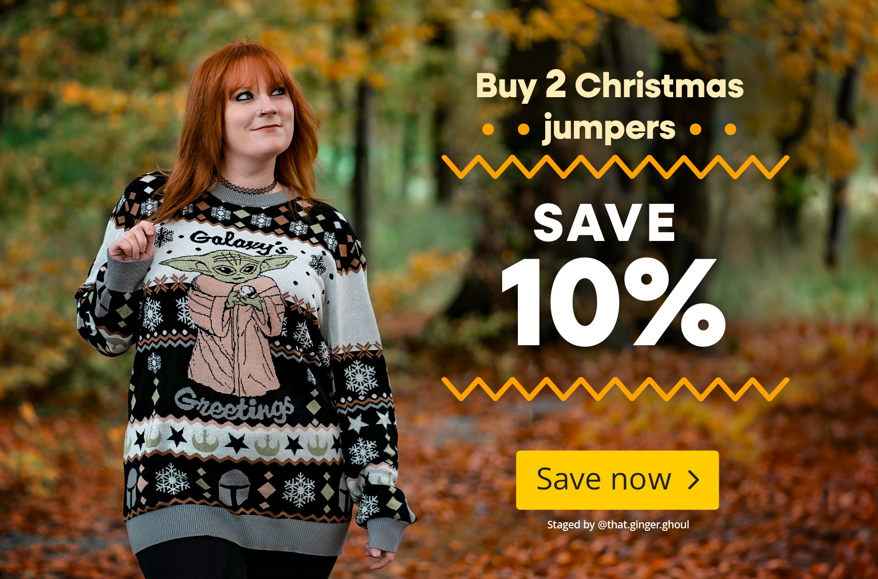 Woman wearing a Baby Yoda Christmas jumper in an autumn forest. Text: “Buy 2 Christmas jumpers, save 10 percent”. Button: “Save now”.