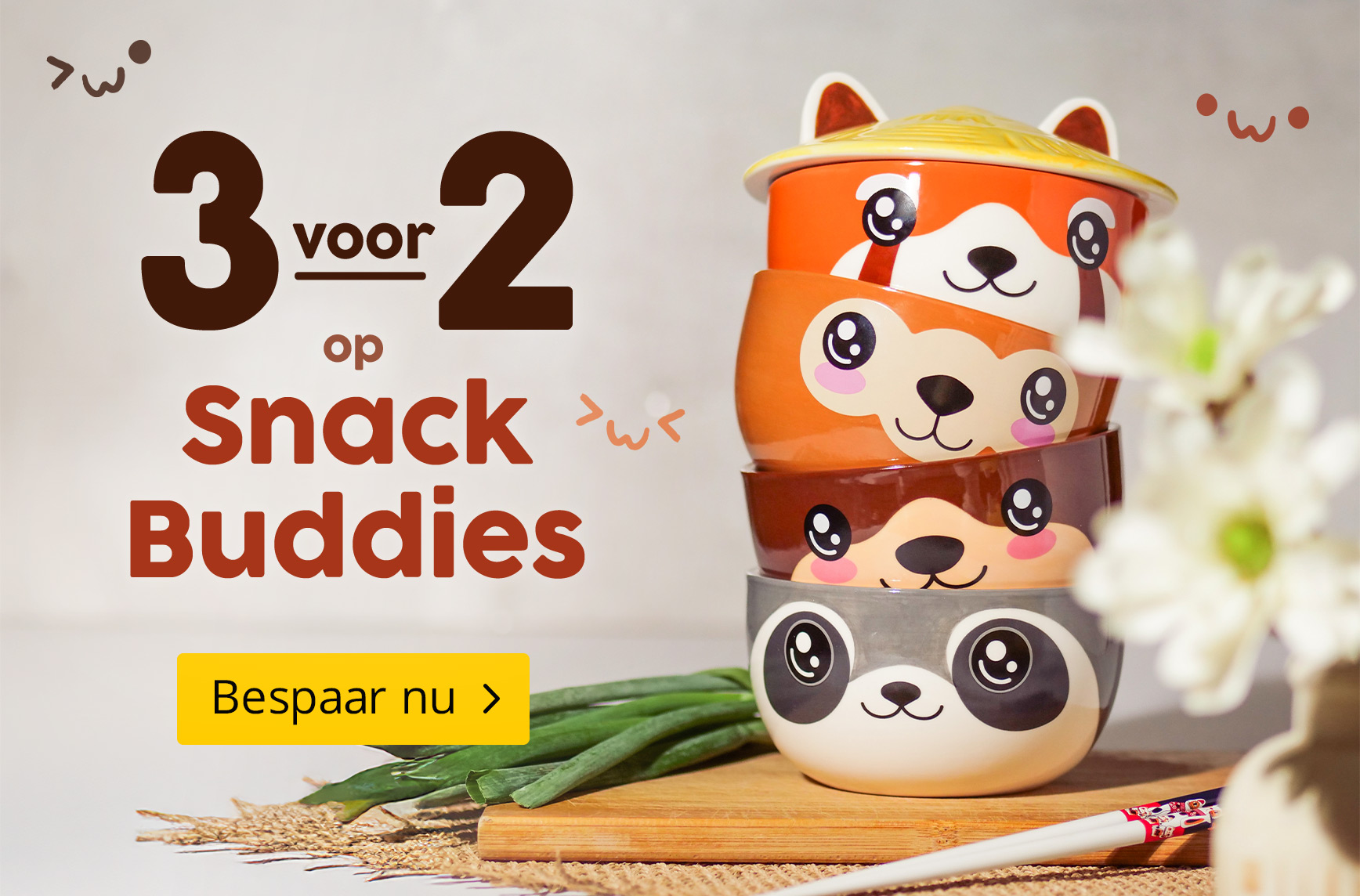 Vier kleurrijke snackkommen met schattige dierengezichten gestapeld op een keukentafel. Tekst: 3 voor 2 op Snack Buddies – Bespaar nu. Elbenwald-promografiek.