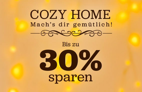 Grafik mit warmen gelben Lichtern im Hintergrund. Text: Cozy Home, Mach’s dir gemütlich, bis zu 30 Prozent sparen.