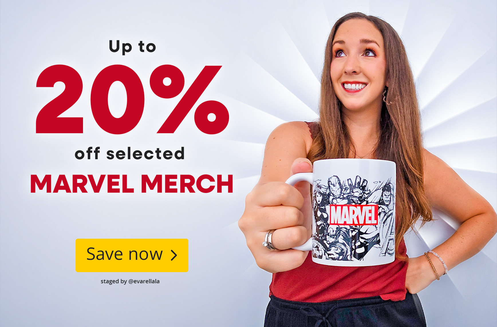 Woman smiling and holding a Marvel mug with comic artwork towards the camera. Text: Up to 20% off selected Marvel merchandise, Shop now.