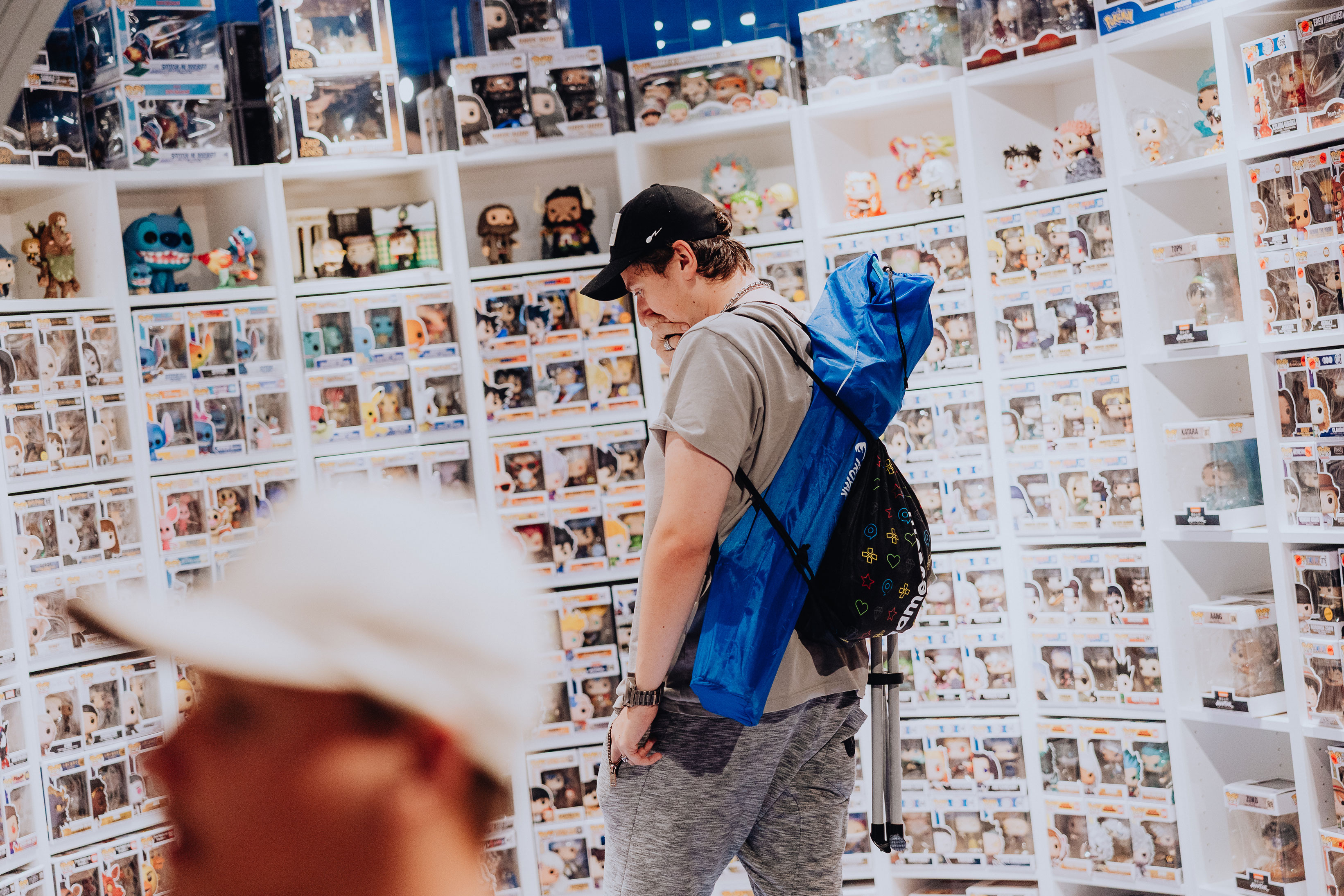 A customer in the Funko room of the Elbenwald store, speechless at the vast selection.