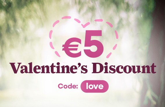 5 € Valentine’s discount with heart symbol on a soft green, blurred nature background.