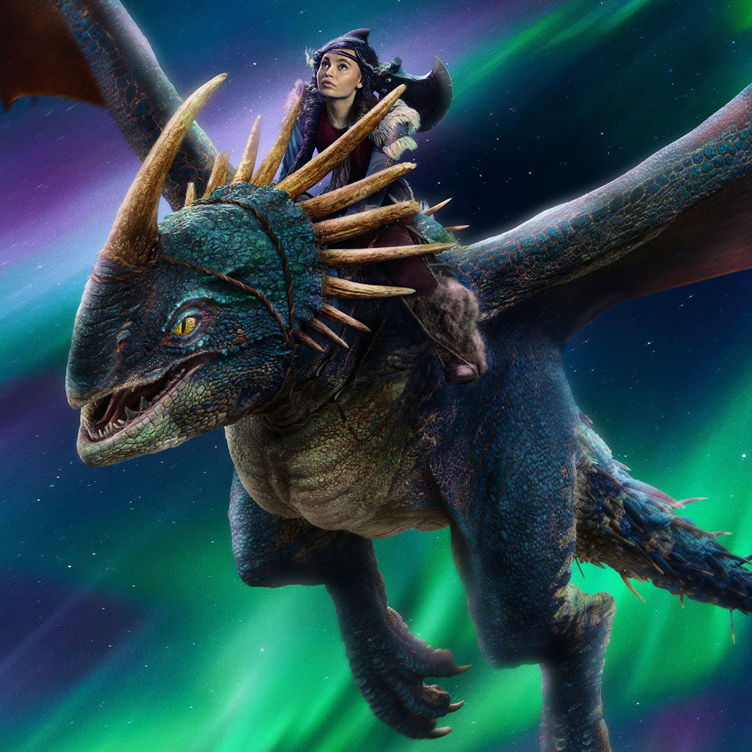 A young girl wearing a Viking helmet rides a large blue dragon with golden horns through the night sky, with northern lights glowing in the background.