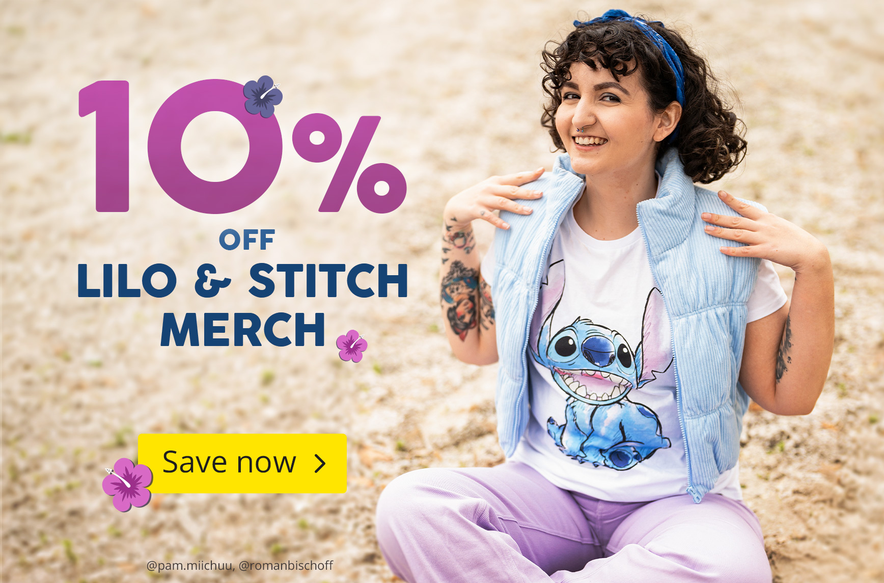 Smiling woman with curly hair sitting on sand, wearing a Stitch T-shirt from Lilo & Stitch. Text: 10% off Lilo & Stitch merch – Save now. Elbenwald promo graphic.