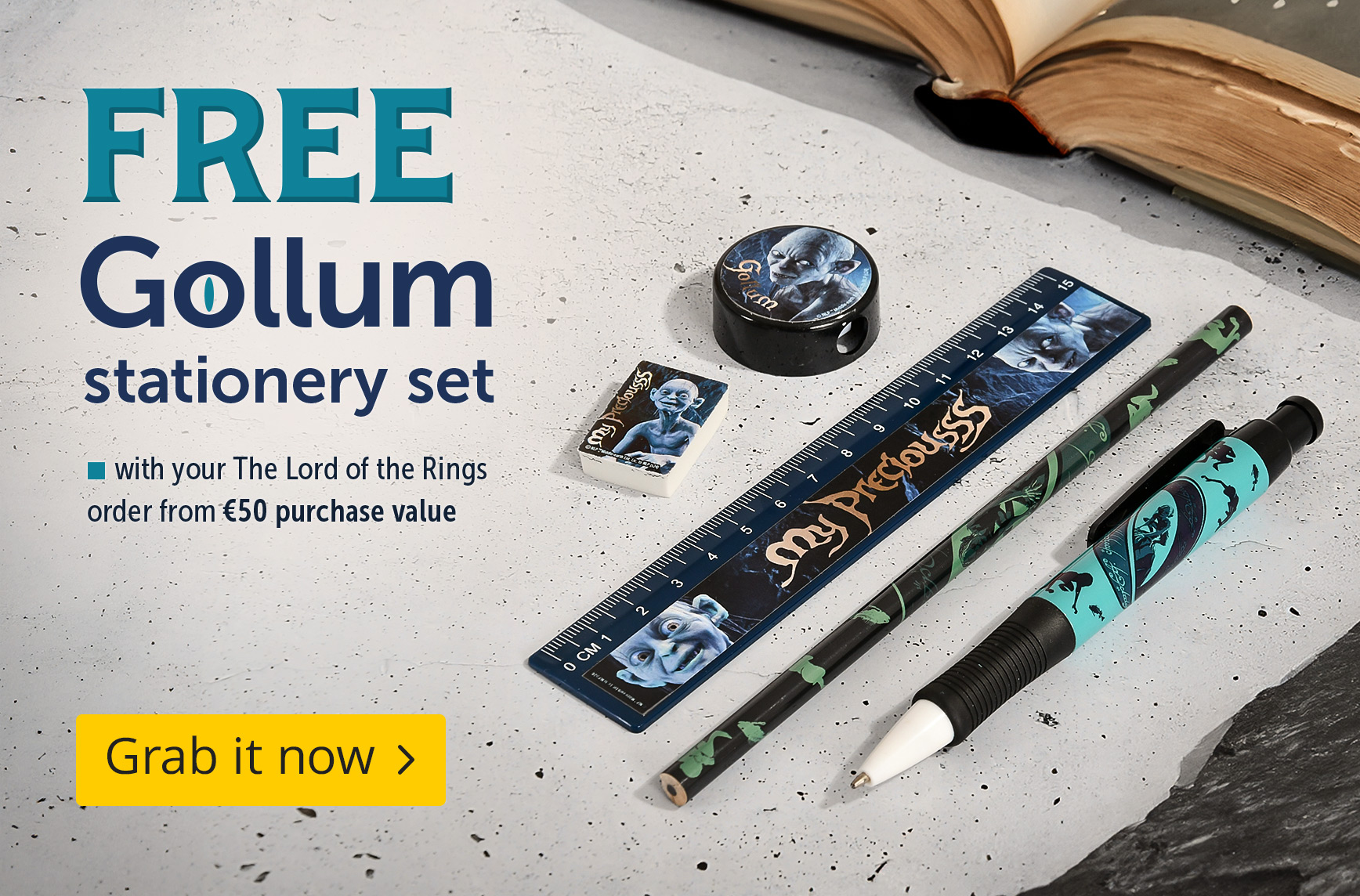 The Lord of the Rings stationery set featuring Gollum design with ruler, pencil, ballpoint pen, eraser and sharpener on a table. Text: Free Gollum stationery set from €50 purchase value, Shop now.
