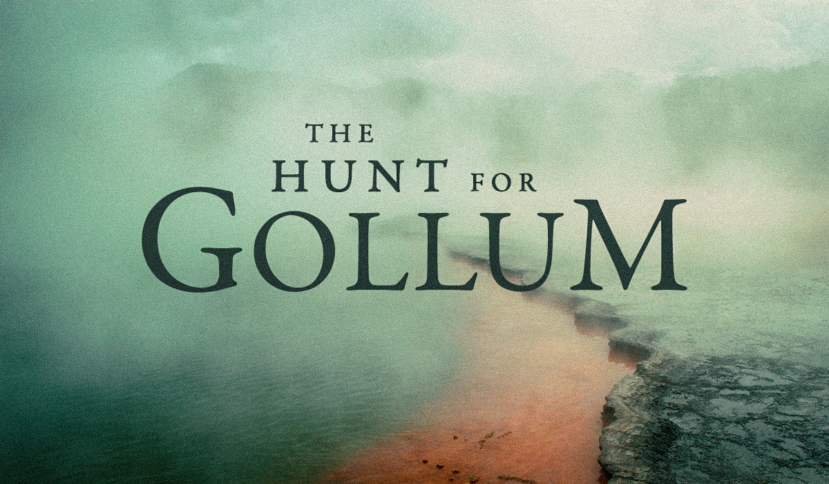 Movie title graphic for "The Hunt for Gollum" set against a misty, atmospheric background. A green-tinted, hazy landscape features a reddish-orange river or path winding into the distance. The text is displayed in a classic serif font, centered on the ima