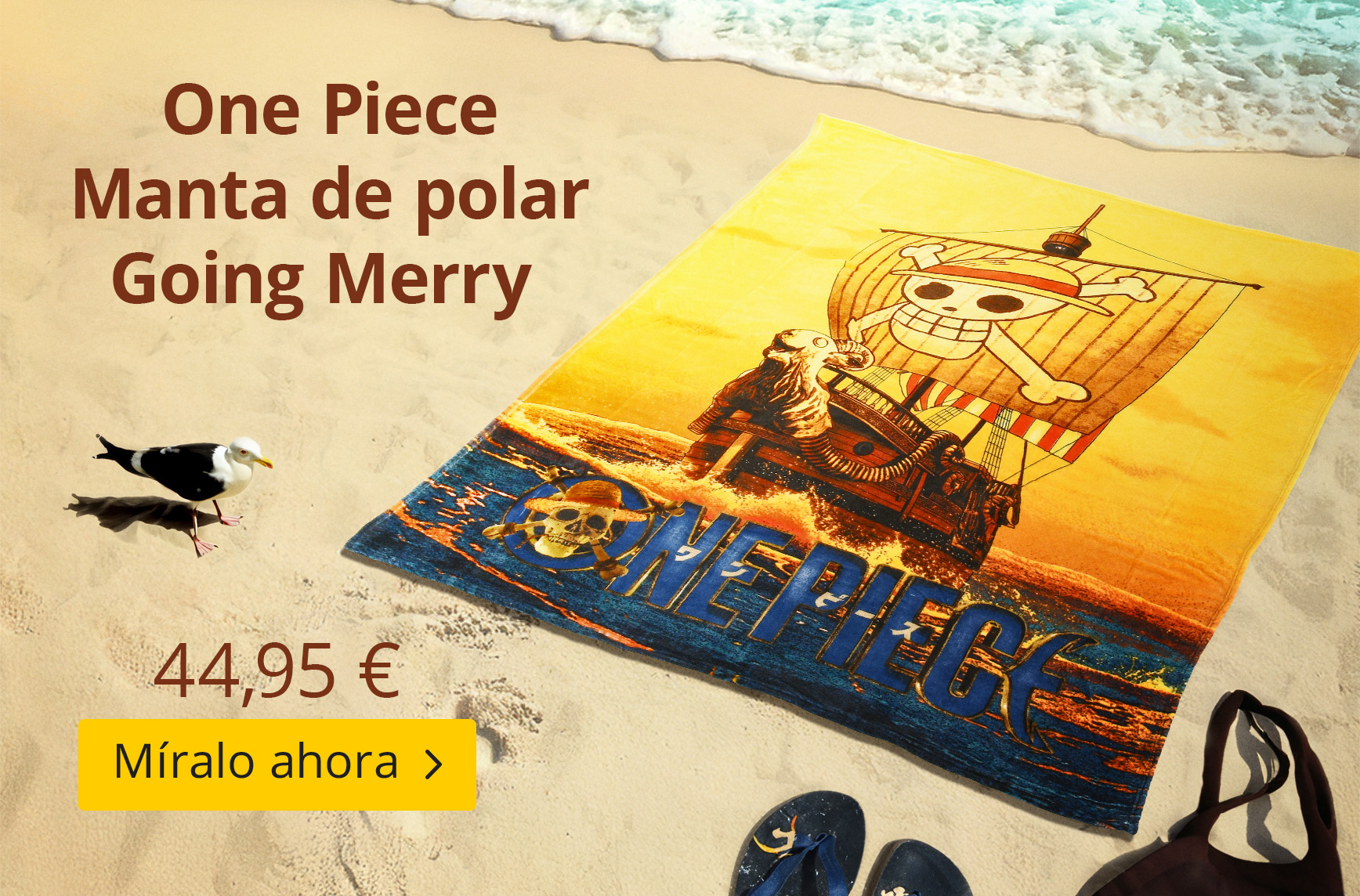 Manta polar de One Piece con diseño del barco Going Merry sobre la arena en la playa. Diseño con el barco de los Piratas del Sombrero de Paja. Texto: One Piece Manta polar Going Merry – 44,95 € – Míralo ahora. Gráfico de producto Elbenwald.
