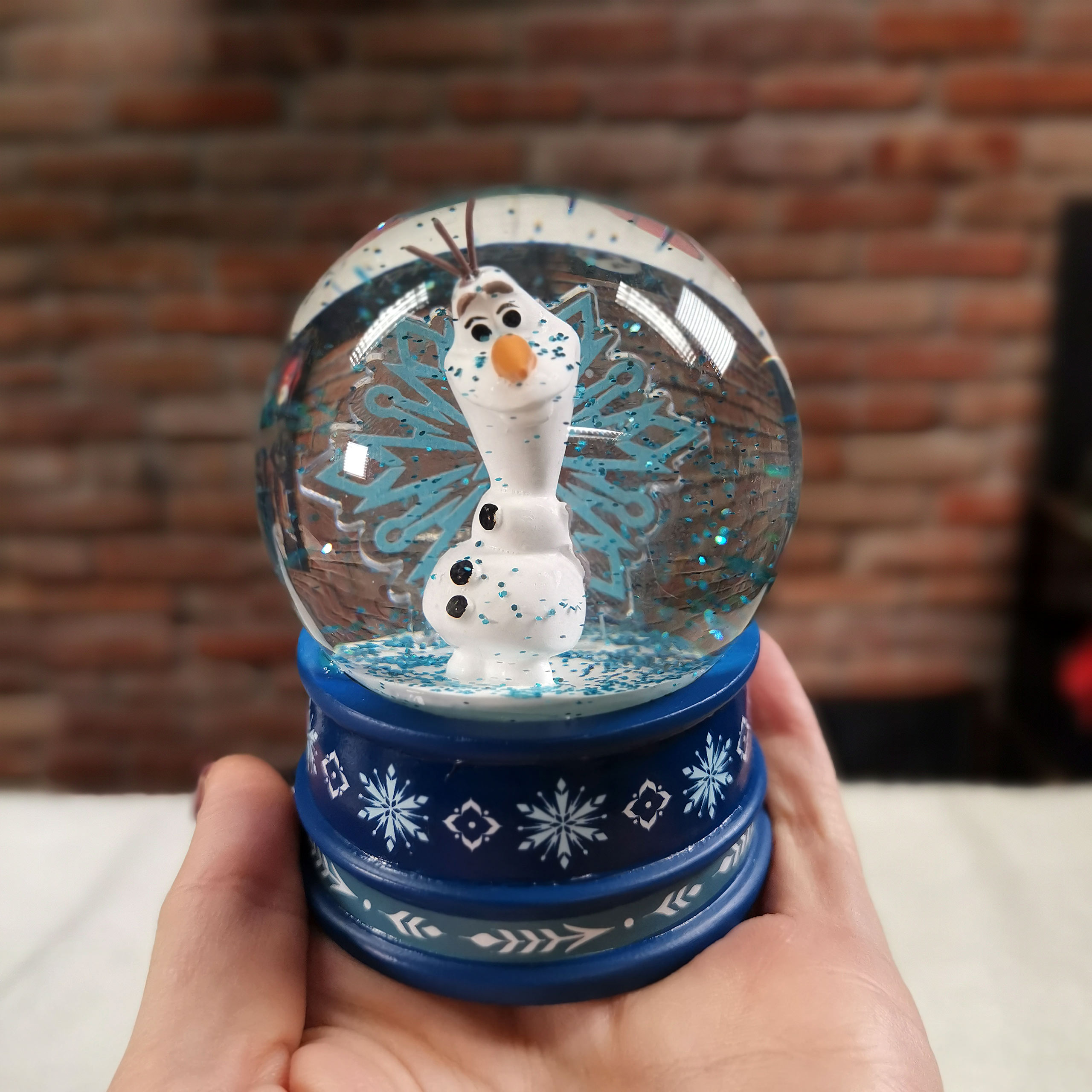 Frozen - Boule à neige Olaf avec paillettes